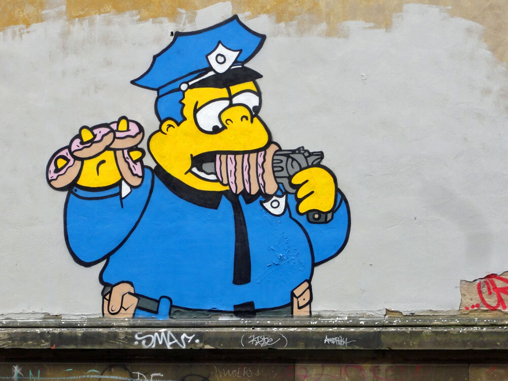simpsons-cop-gun-donuts.jpg